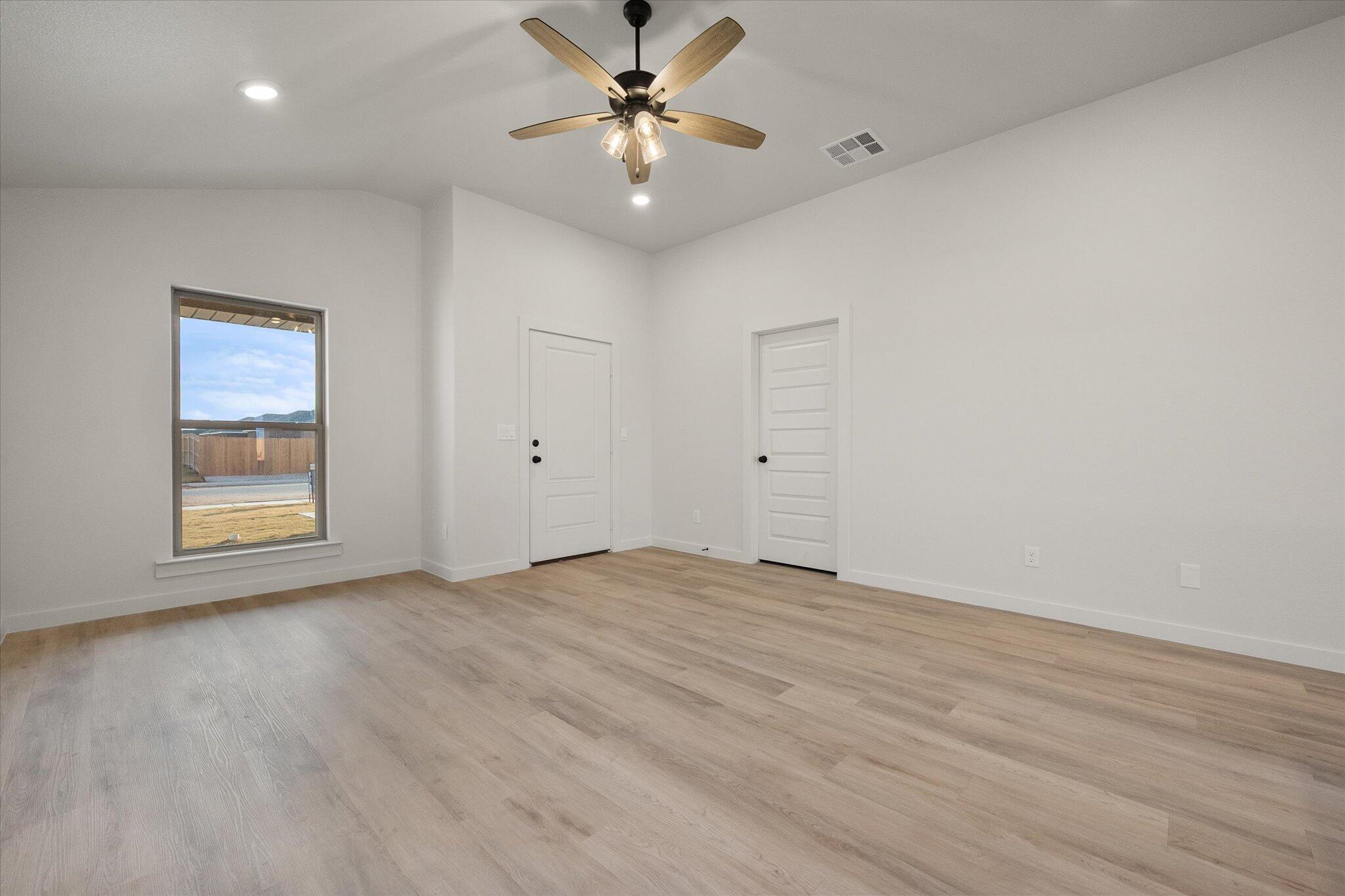 3022 138th Place Lubbock, TX 79423 - Photo 5 of 20 a view of an empty room with a window