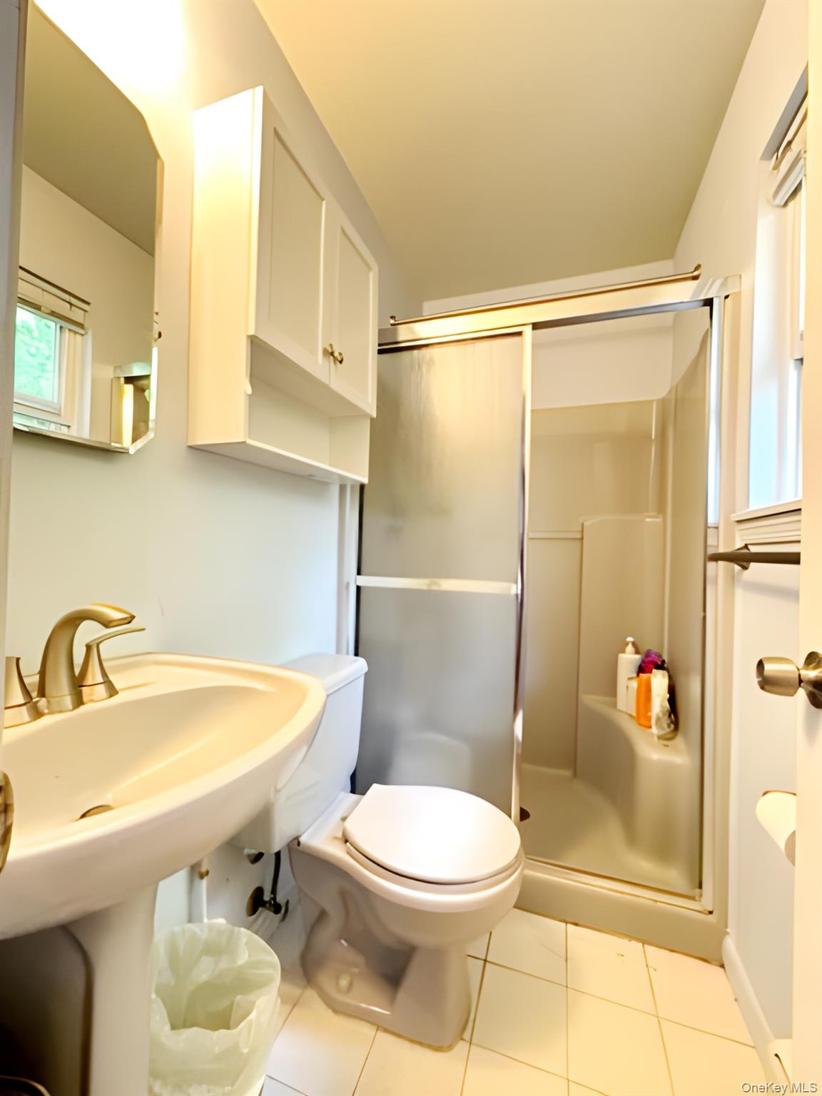 60 Aloma Road Rocky Point, NY 11778 - Photo 13 of 34 Bathroom with a stall shower and tile patterned flooring
