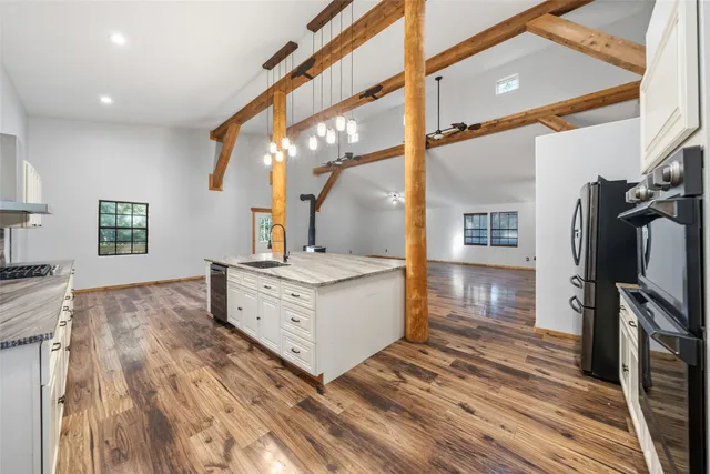 a spacious bathroom with a double vanity sink and a mirror