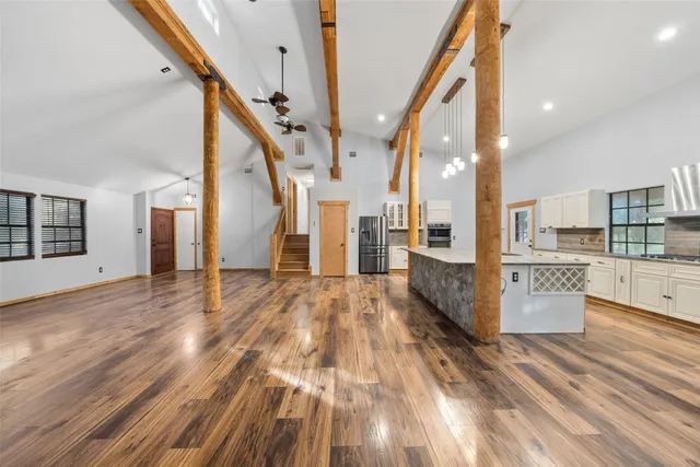 a view of a house with wooden floor and stairs