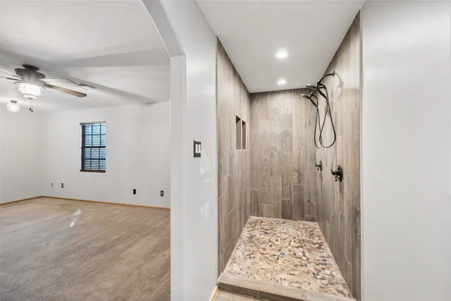 a bathroom with a shower and a sink