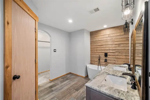 a bathroom with a bathtub and shower