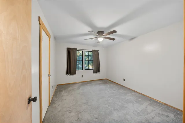 a view of hallway with wooden floor