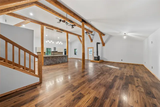 a view of an entryway with wooden floor