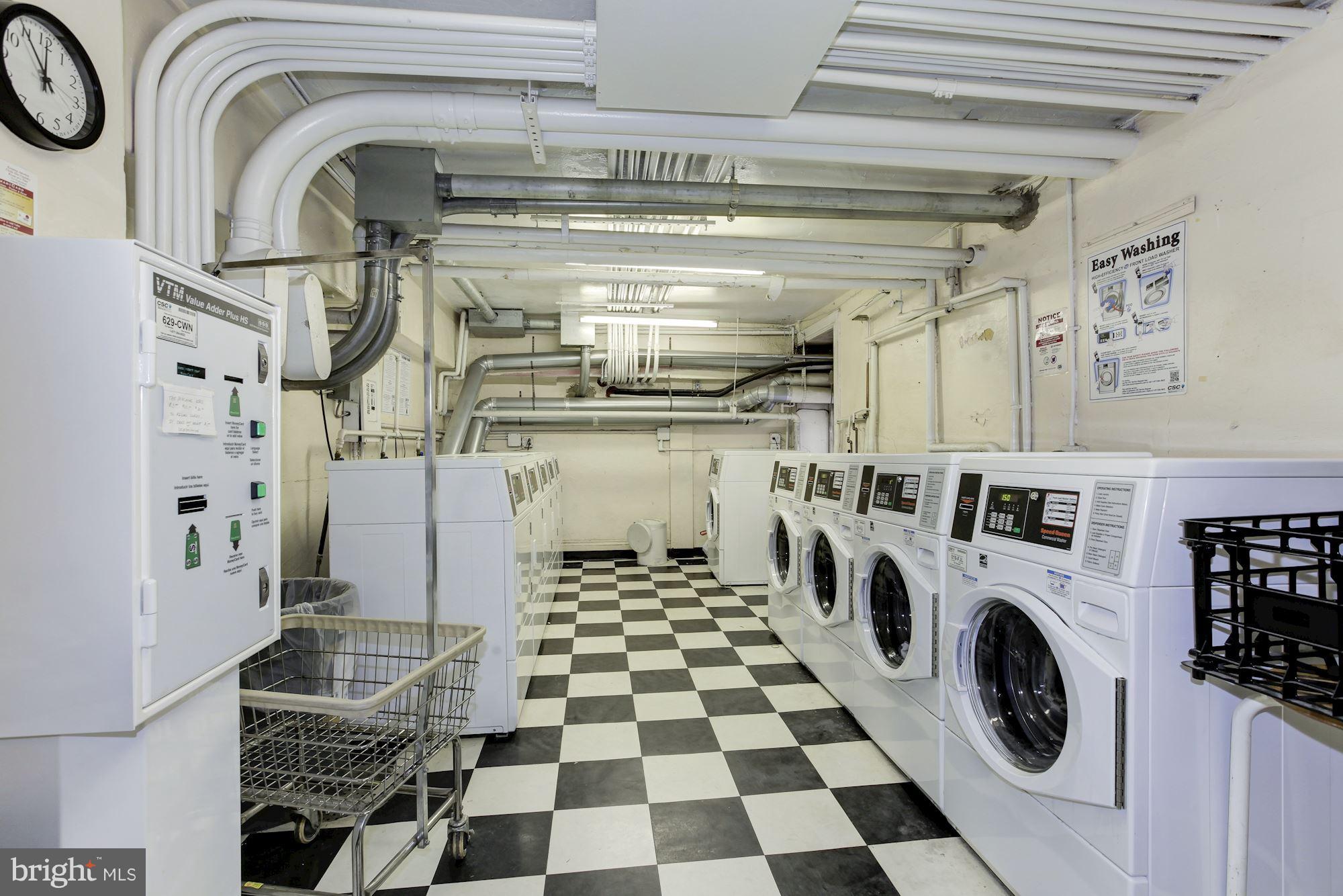 1851 Columbia Road Northwest, Unit 305 Washington, DC 20009 - Photo 17 of 28 a view of a storage & utility room with washer and dryer