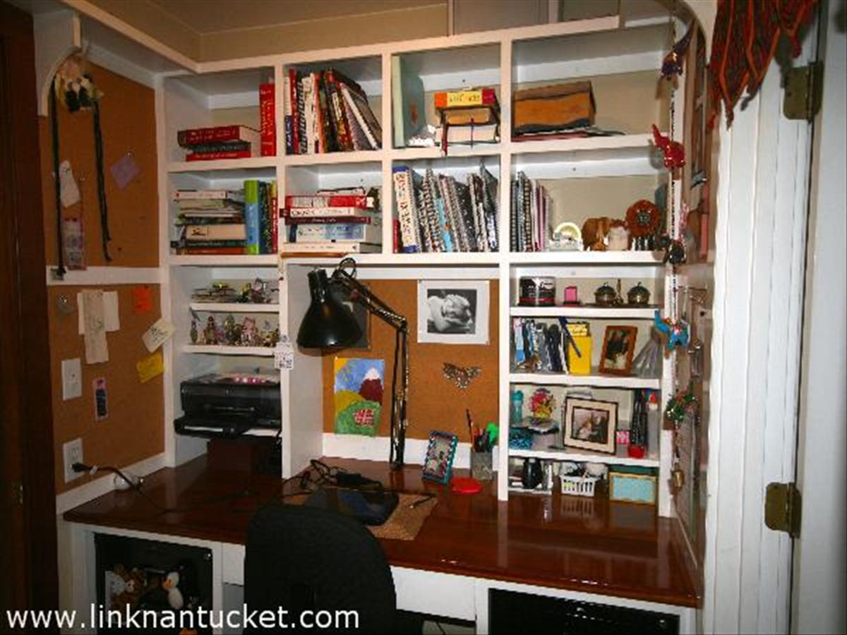 22 Miacomet Road Nantucket, MA 02554 - Photo 17 of 19 a view of a workspace with bookshelf