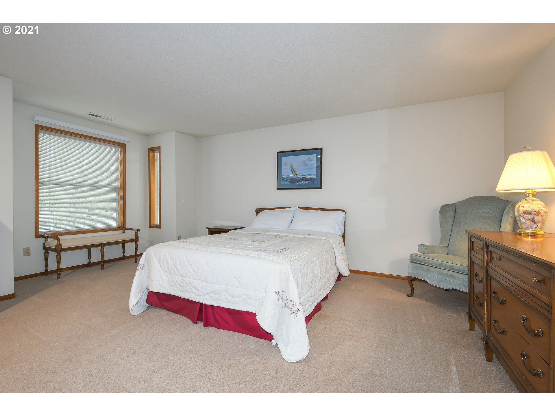 15917 Northeast Union Road, Unit 91 Ridgefield, WA 98642 - Photo 14 of 28 a bedroom with a bed and a dressers