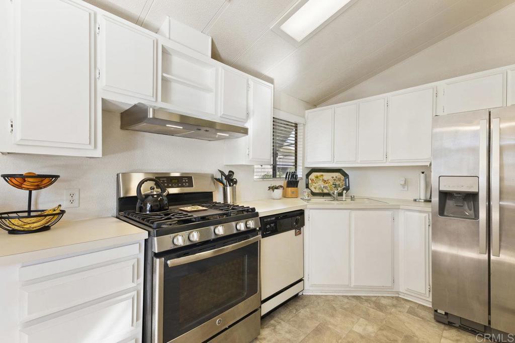 1476 Dover Street Oceanside, CA 92057 - Photo 11 of 45 a kitchen with stainless steel appliances granite countertop a refrigerator and a stove