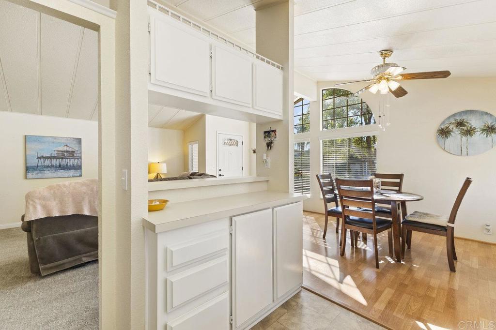 1476 Dover Street Oceanside, CA 92057 - Photo 12 of 45 a view of a dining room with furniture a chandelier and wooden floor