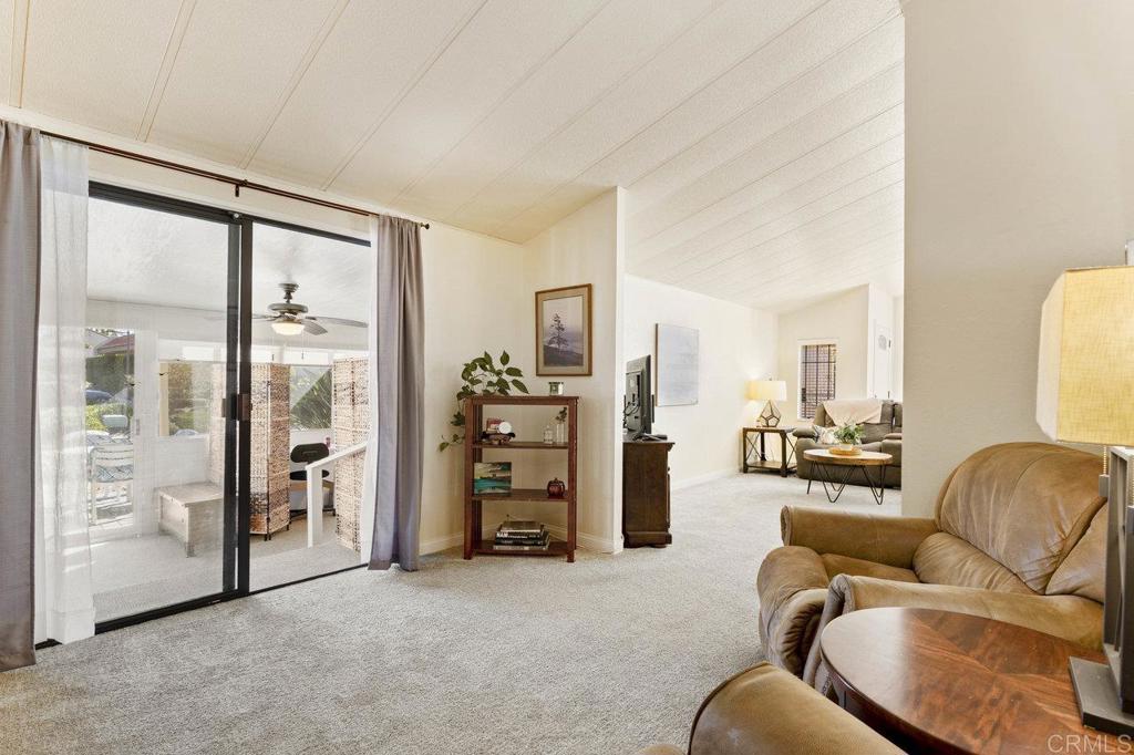 1476 Dover Street Oceanside, CA 92057 - Photo 15 of 45 a living room with furniture and large windows