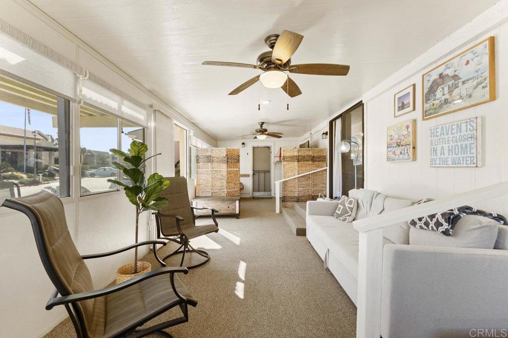 1476 Dover Street Oceanside, CA 92057 - Photo 18 of 45 a living room with furniture and floor to ceiling windows