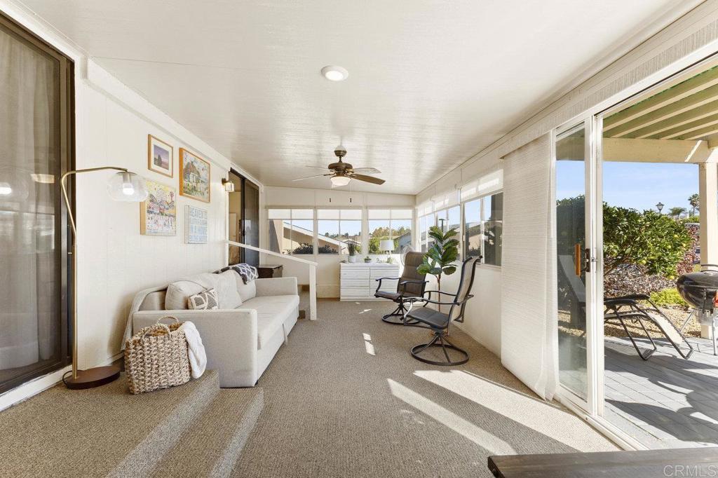 1476 Dover Street Oceanside, CA 92057 - Photo 19 of 45 a living room with furniture gym equipment and floor to ceiling window