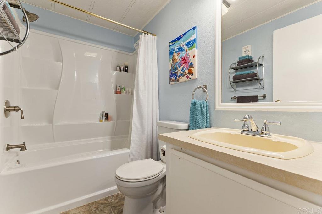 1476 Dover Street Oceanside, CA 92057 - Photo 29 of 45 a bathroom with a sink a toilet and a bathtub