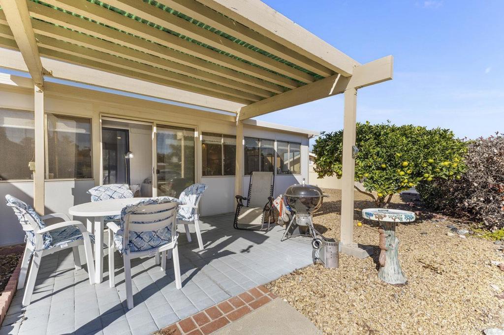 1476 Dover Street Oceanside, CA 92057 - Photo 32 of 45 a view of a patio with table and chairs and potted plants