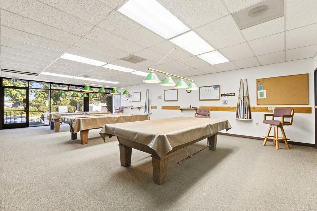 1476 Dover Street Oceanside, CA 92057 - Photo 35 of 45 a living room with furniture and a table with projector the view