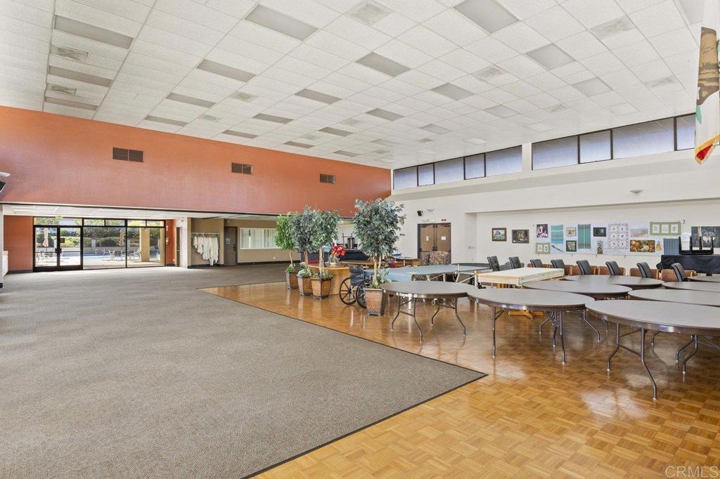 1476 Dover Street Oceanside, CA 92057 - Photo 38 of 45 a living room with furniture a clock on wall and a table