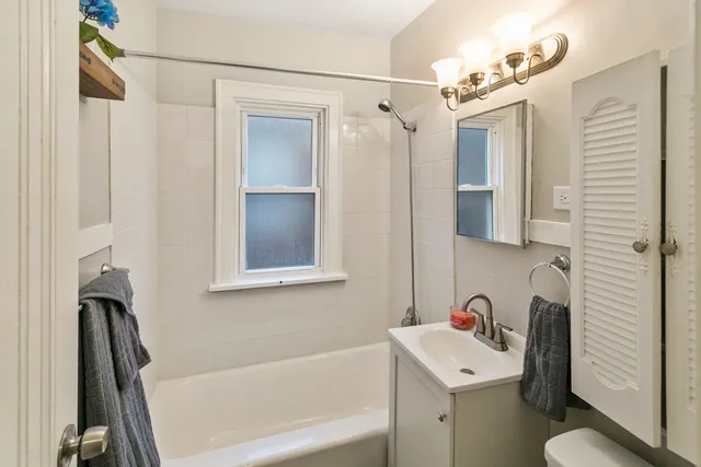 a bathroom with a sink a toilet and a bathtub