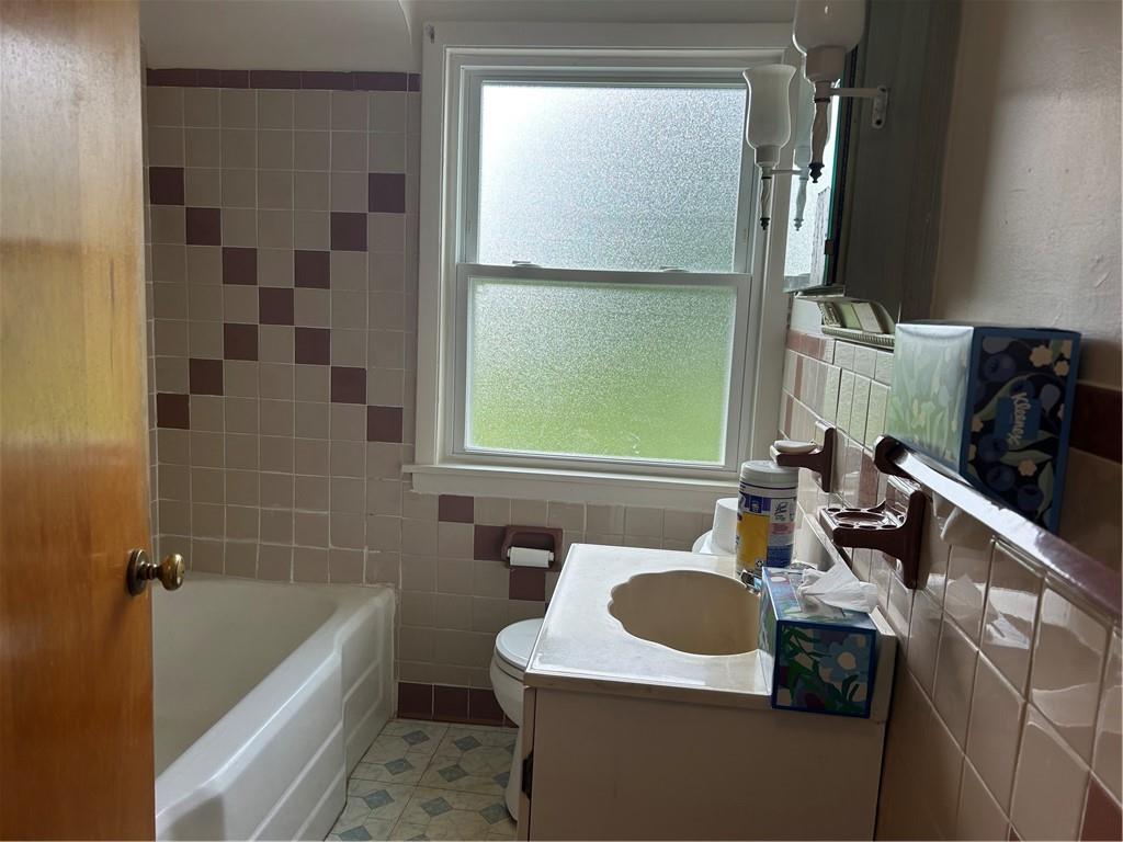 314 Terrace McKeesport, PA 15135 - Photo 11 of 19 a bathroom with a sink toilet and tub