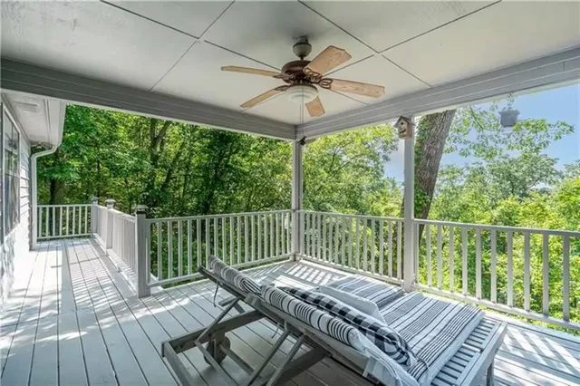a view of a balcony with wooden floor