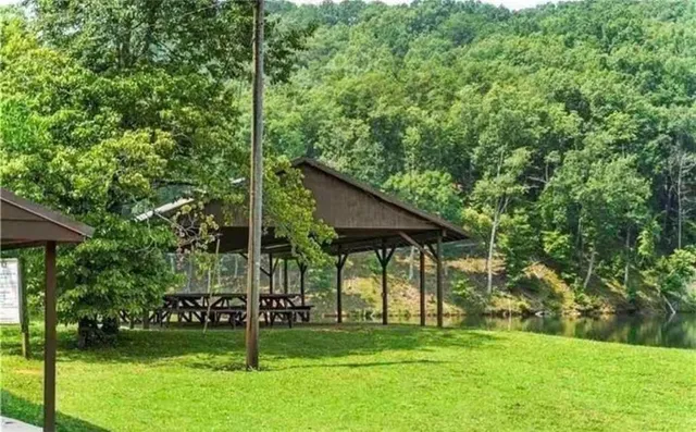 a view of a wooden deck and a yard