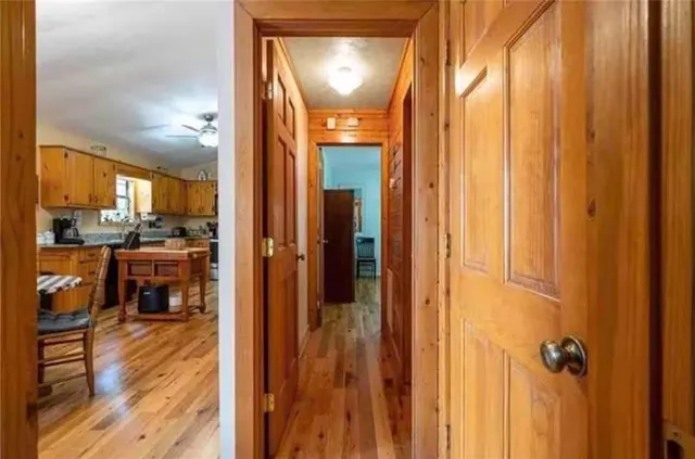 a view of a kitchen from the hallway