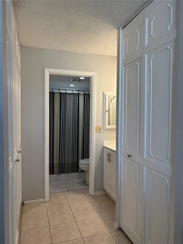 a white toilet sitting next to a bathroom sink