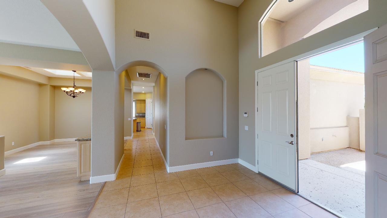 a view of a hallway with wooden shelves