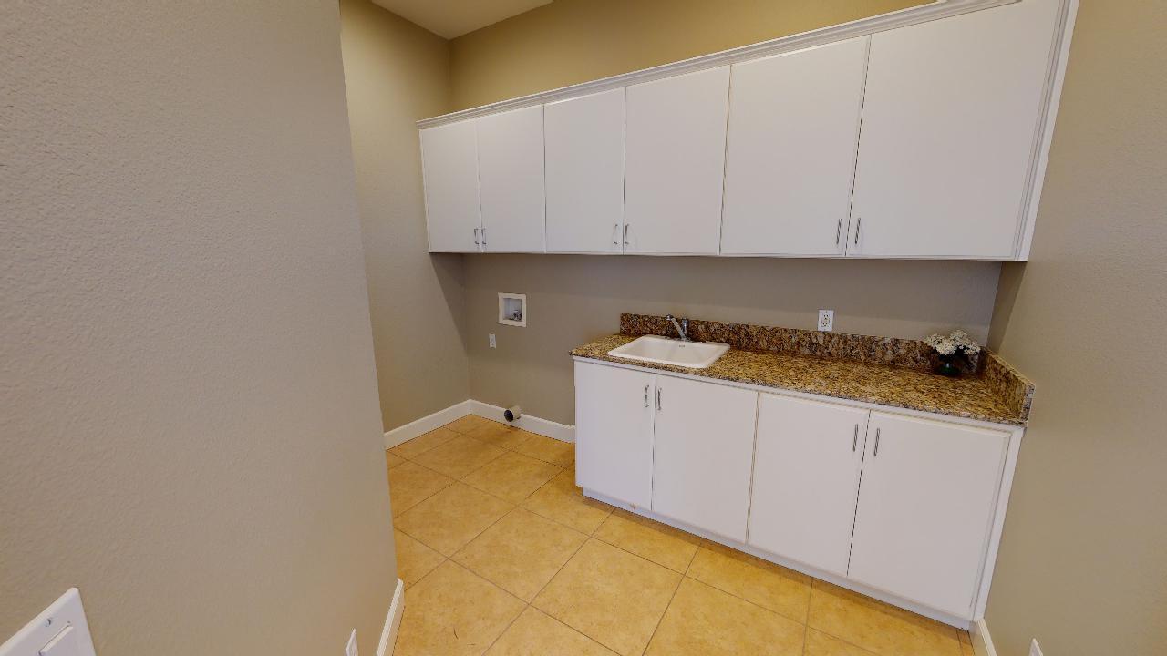 8 Picasso Court Rancho Mirage, CA 92270 - Photo 14 of 26 a kitchen with granite countertop white cabinets and sink