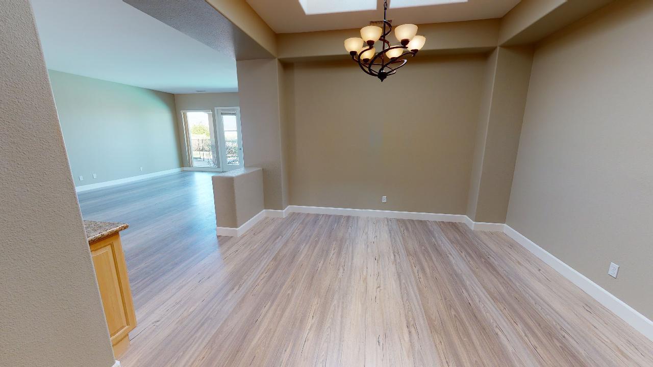 8 Picasso Court Rancho Mirage, CA 92270 - Photo 18 of 26 a view of livingroom with hardwood floor and window