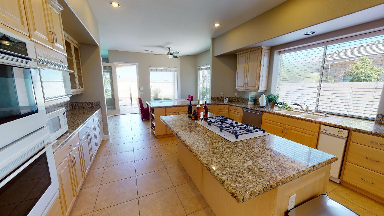 8 Picasso Court Rancho Mirage, CA 92270 - Photo 19 of 26 a large swimming pool with a large window