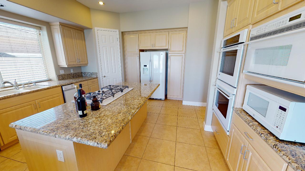 8 Picasso Court Rancho Mirage, CA 92270 - Photo 20 of 26 a bathroom with a granite countertop sink and a mirror