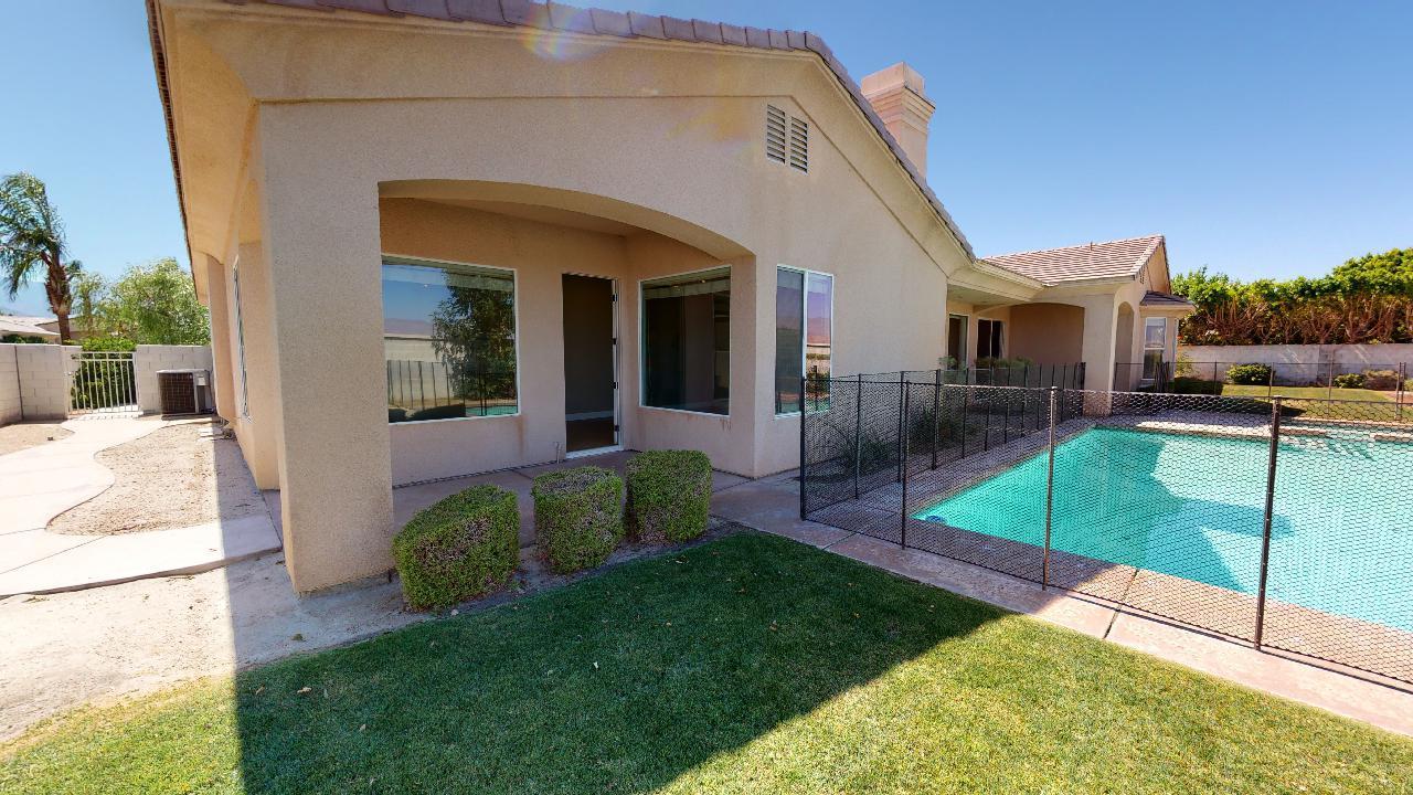 8 Picasso Court Rancho Mirage, CA 92270 - Photo 23 of 26 a view of a house with backyard and porch
