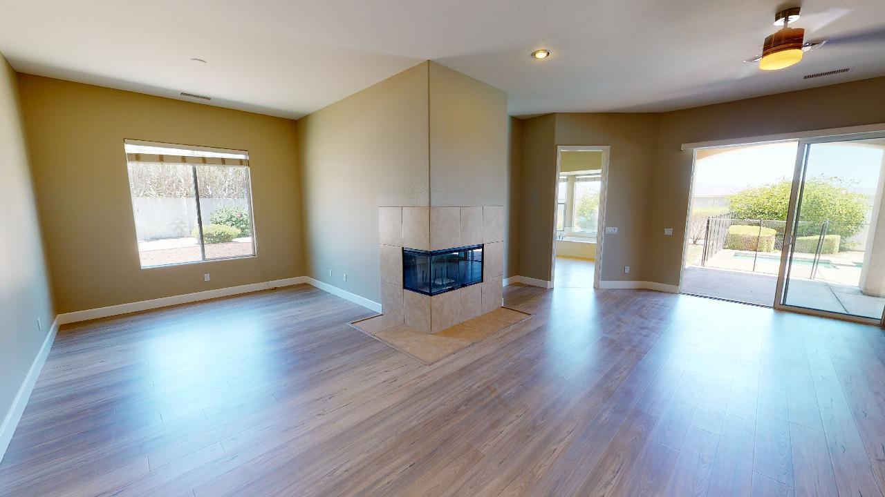 8 Picasso Court Rancho Mirage, CA 92270 - Photo 4 of 26 a view of an empty room with wooden floor and a window