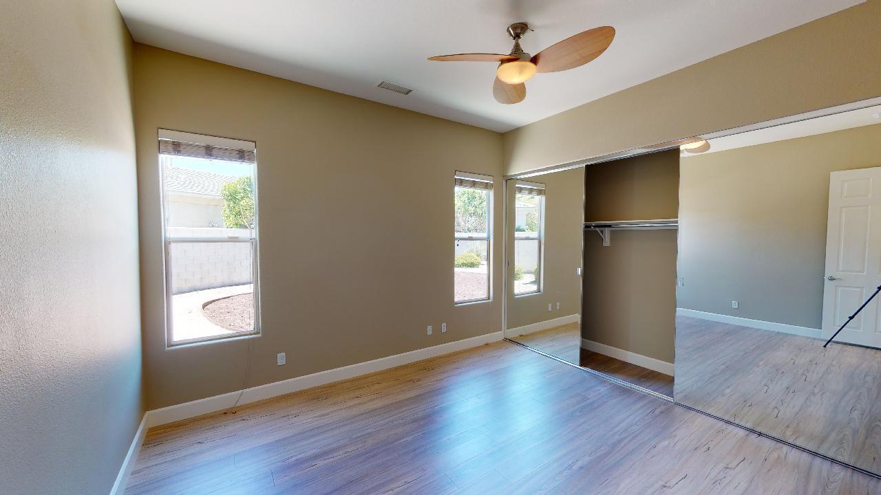 8 Picasso Court Rancho Mirage, CA 92270 - Photo 8 of 26 a view of an empty room with window and wooden floor