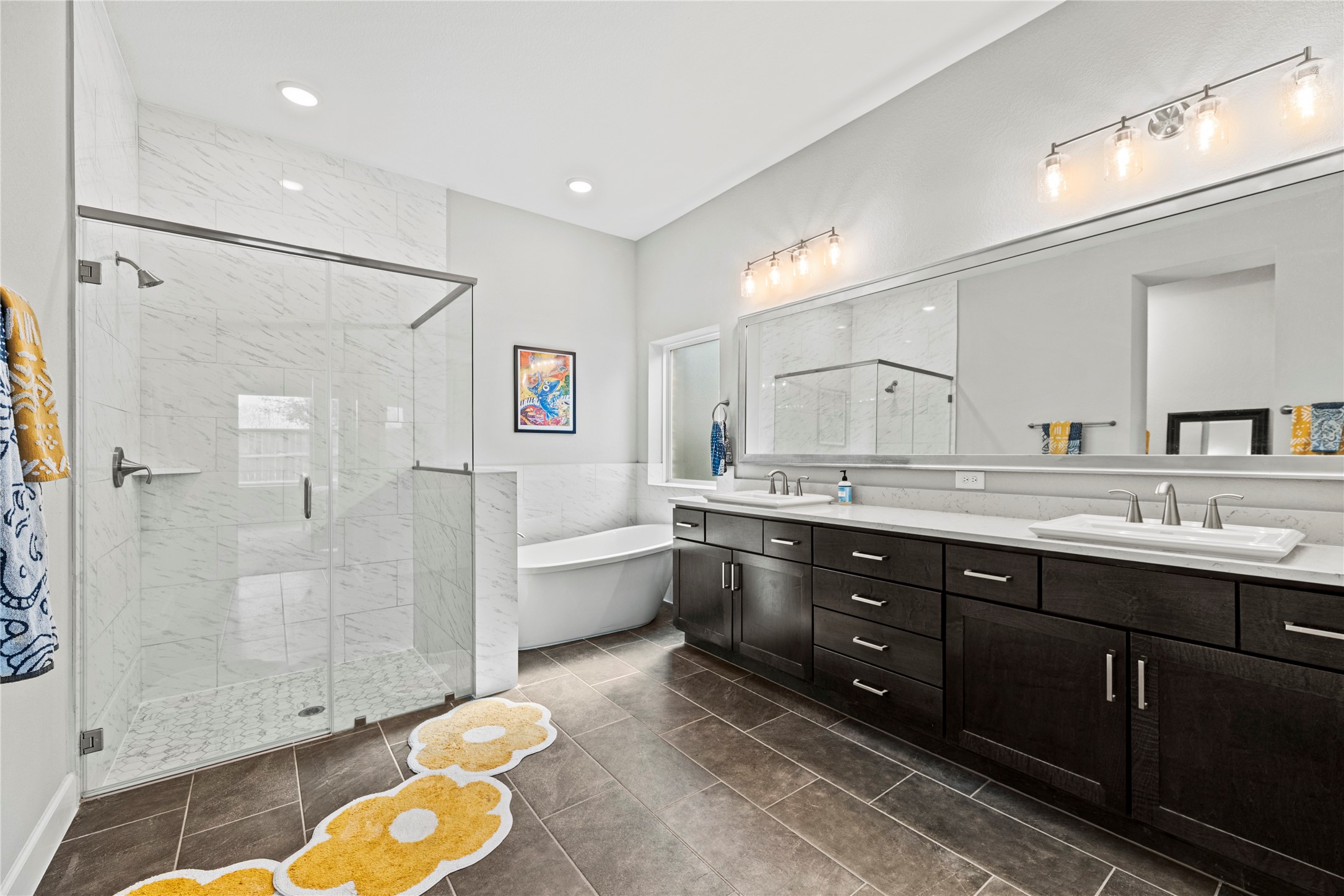 3127 Swift Way Katy, TX 77493 - Photo 18 of 25 Primary bathroom is complete with a dual sink vanity, soaking tub, oversized shower and a walk-in closet.