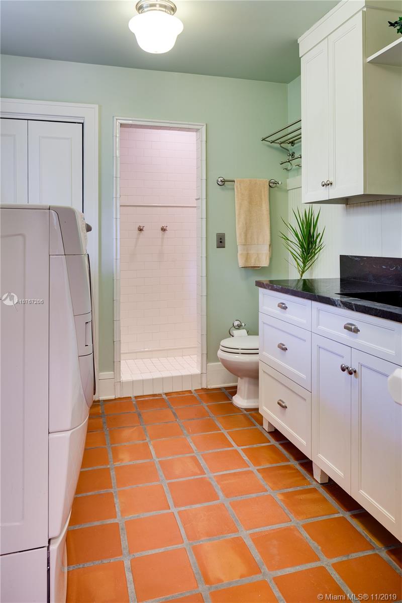 13599 Old Cutler Road Pinecrest, FL 33156 - Photo 22 of 40 Laundry room with plenty of storage and bathroom