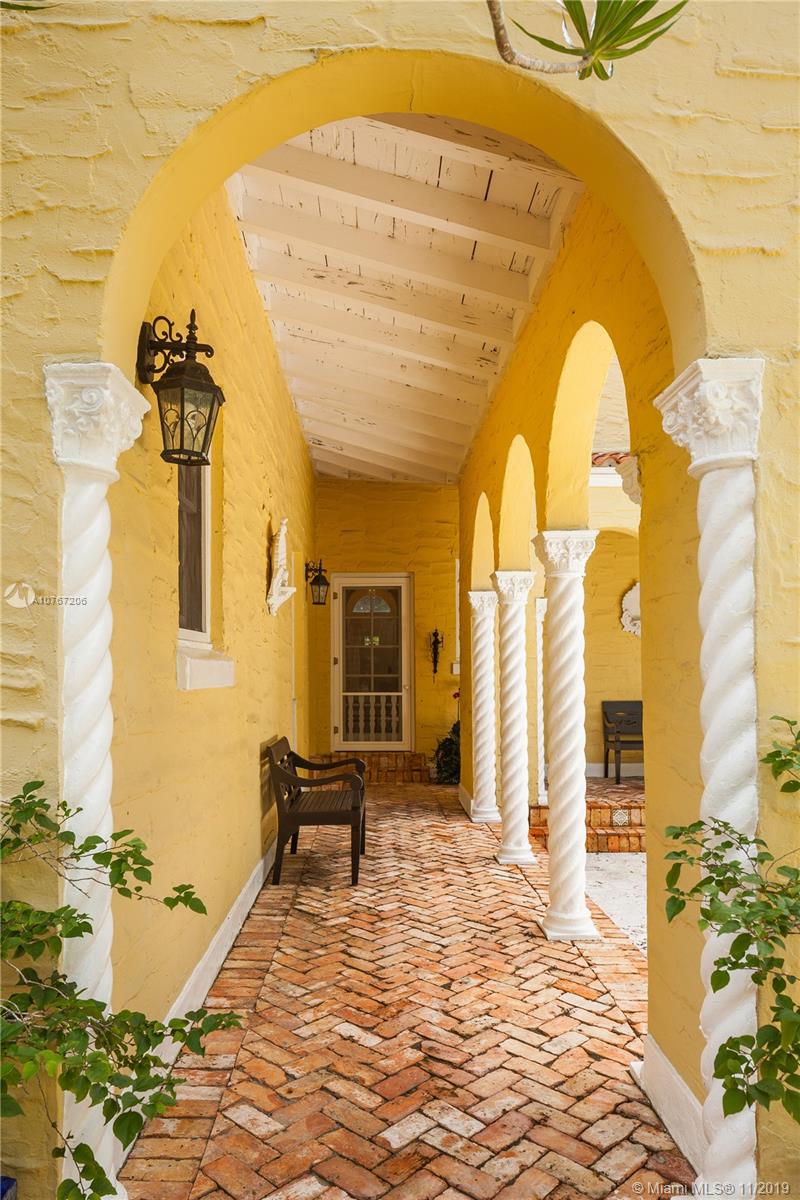 13599 Old Cutler Road Pinecrest, FL 33156 - Photo 4 of 40 Brick-pavers and pecky cypress adorn the side porch