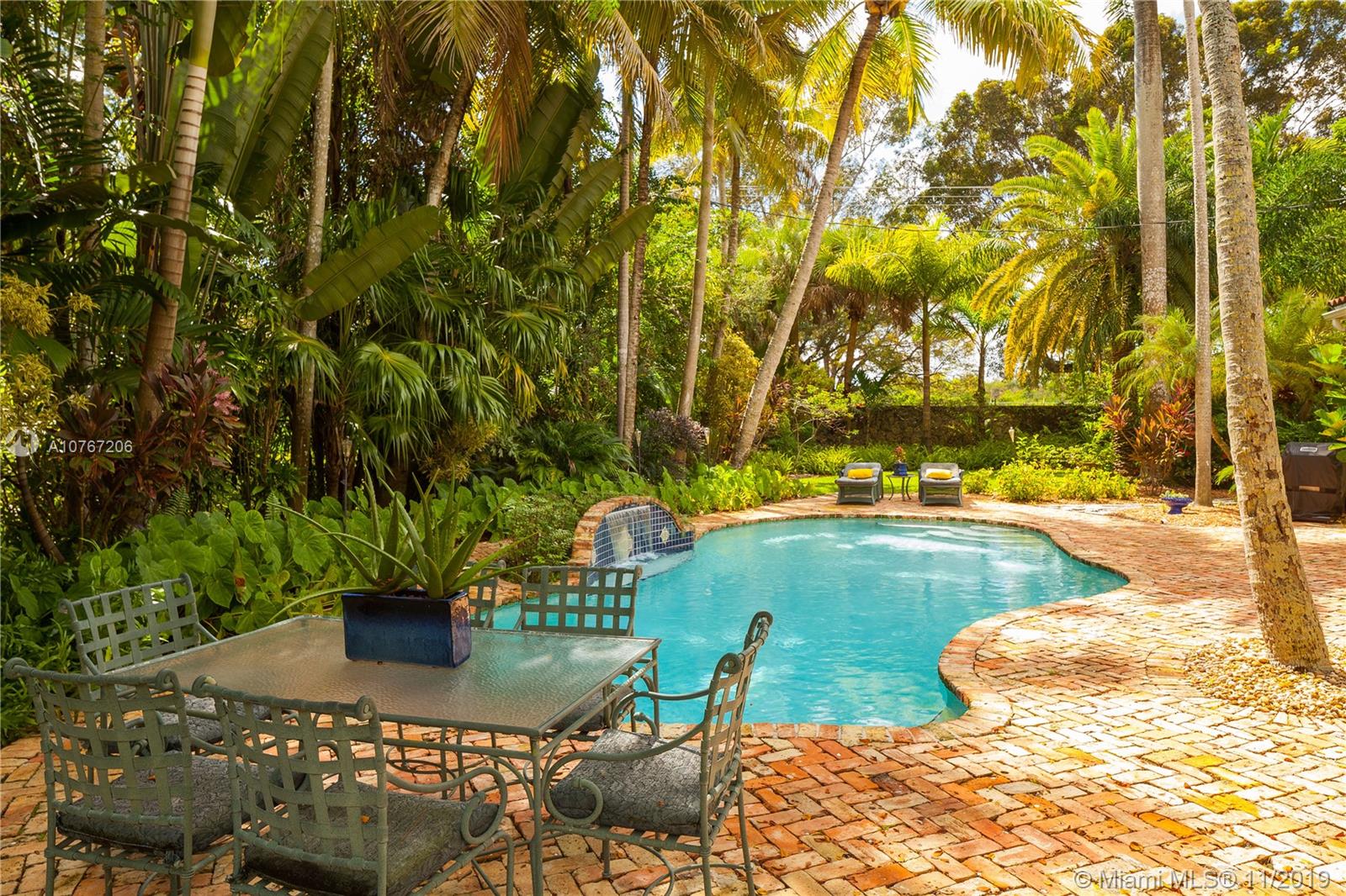 13599 Old Cutler Road Pinecrest, FL 33156 - Photo 31 of 40 Pool featuring waterfall