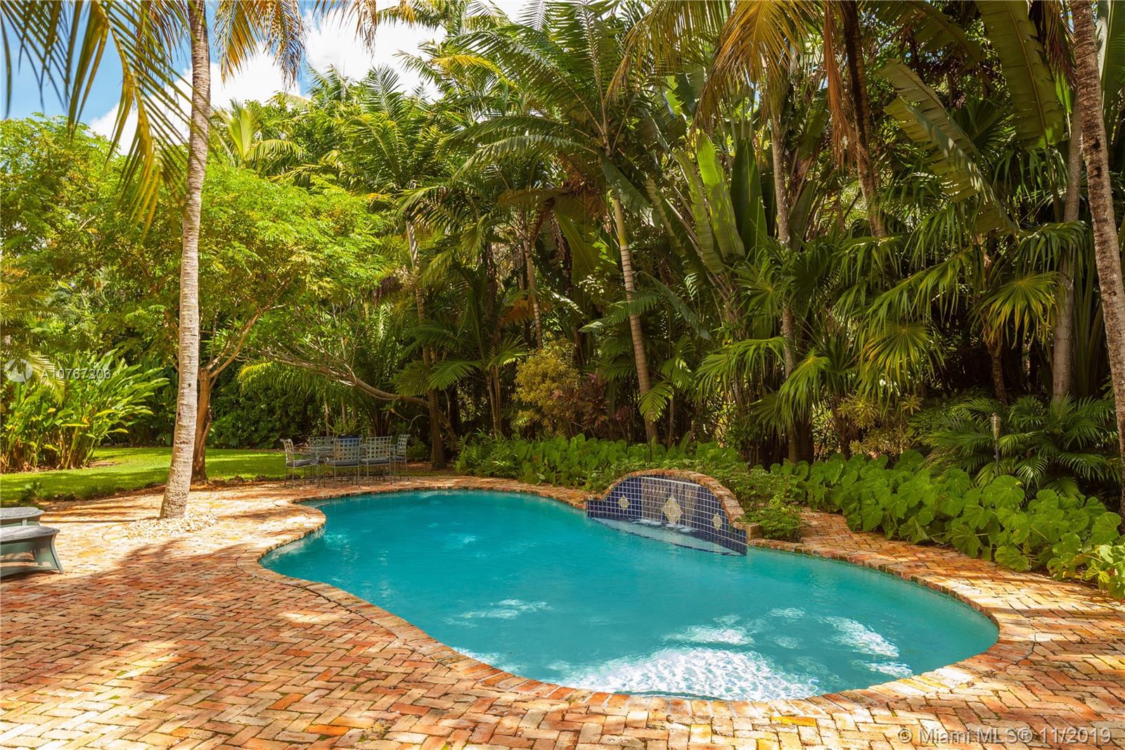 13599 Old Cutler Road Pinecrest, FL 33156 - Photo 32 of 40 Verdant backdrop while lounging in the pool
