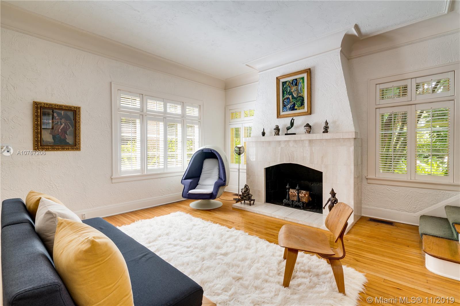 13599 Old Cutler Road Pinecrest, FL 33156 - Photo 6 of 40 Formal living room with wood-burning fireplace
