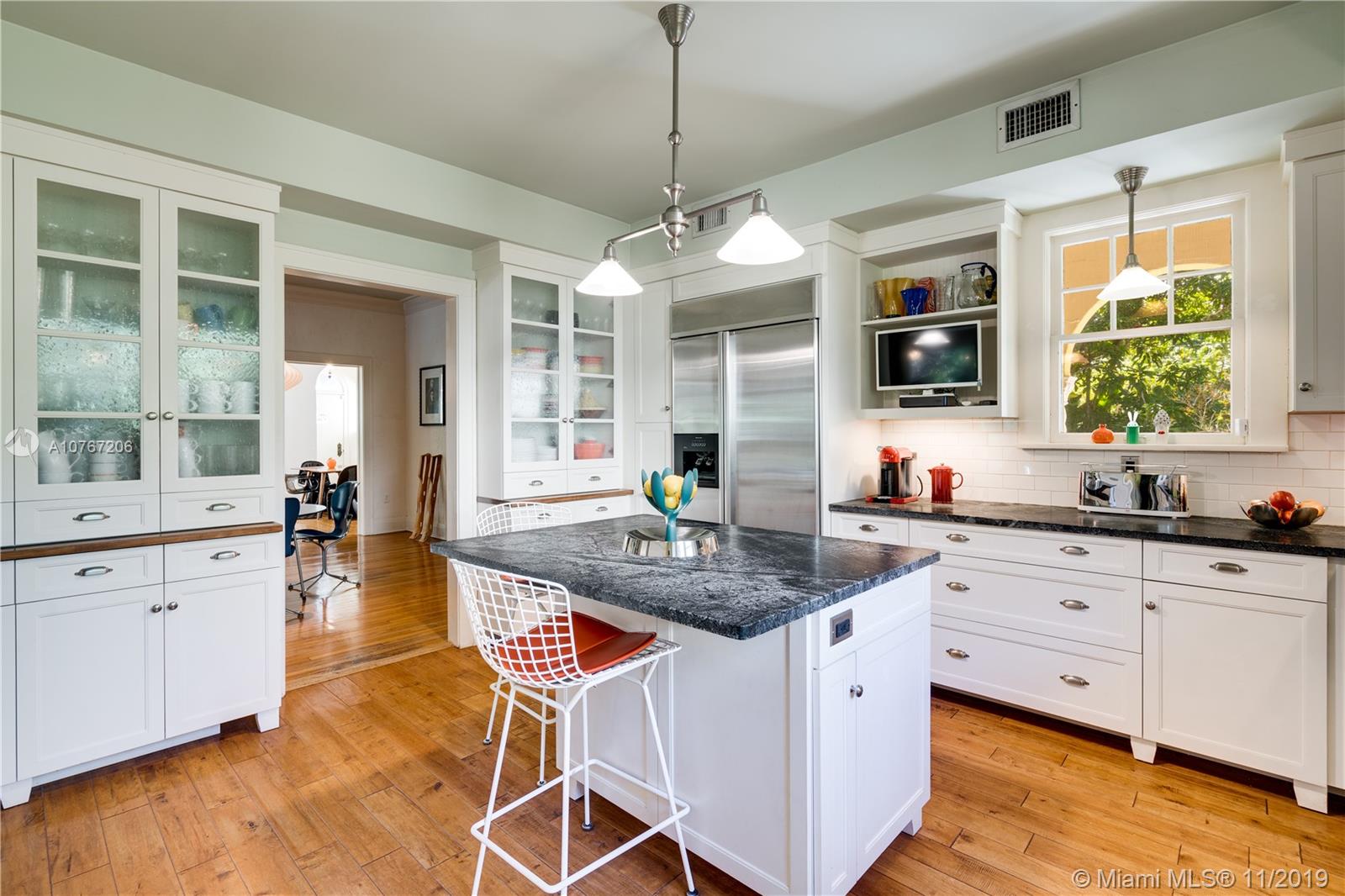 13599 Old Cutler Road Pinecrest, FL 33156 - Photo 10 of 40 Center island keeps kitchen functional & social