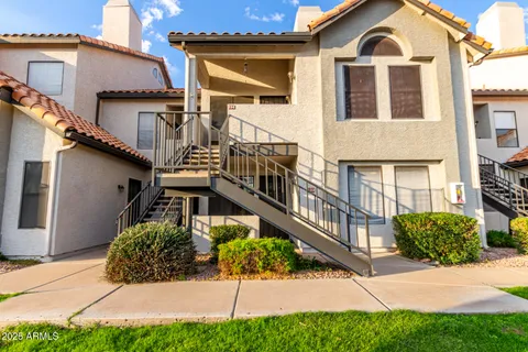 a view of a house with a yard and plants