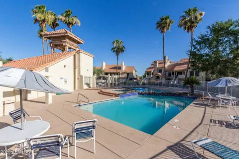 a front view of a house with a garden and pathway