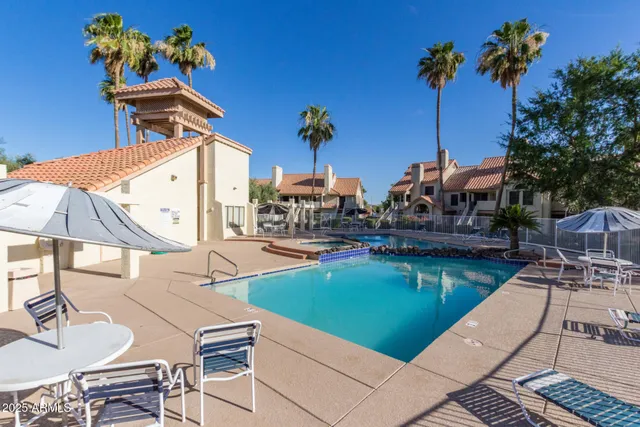 a front view of a house with a garden and pathway