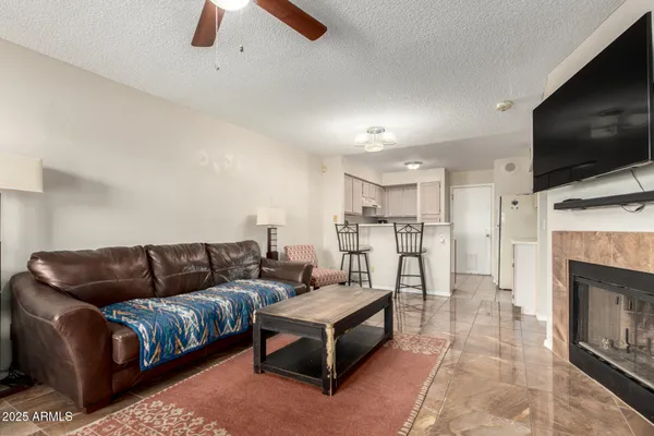 a living room with furniture and a flat screen tv