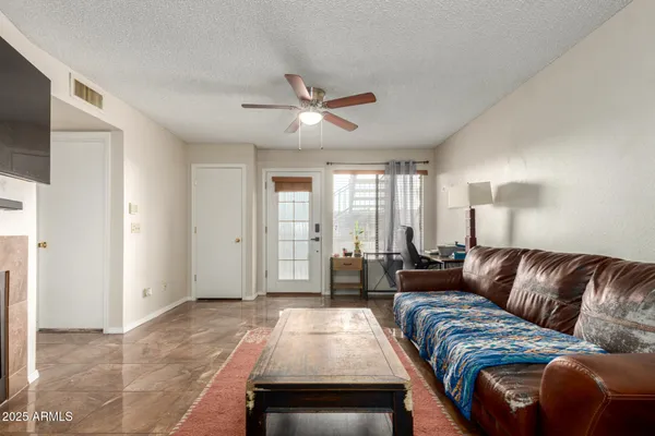a living room with furniture and a large window