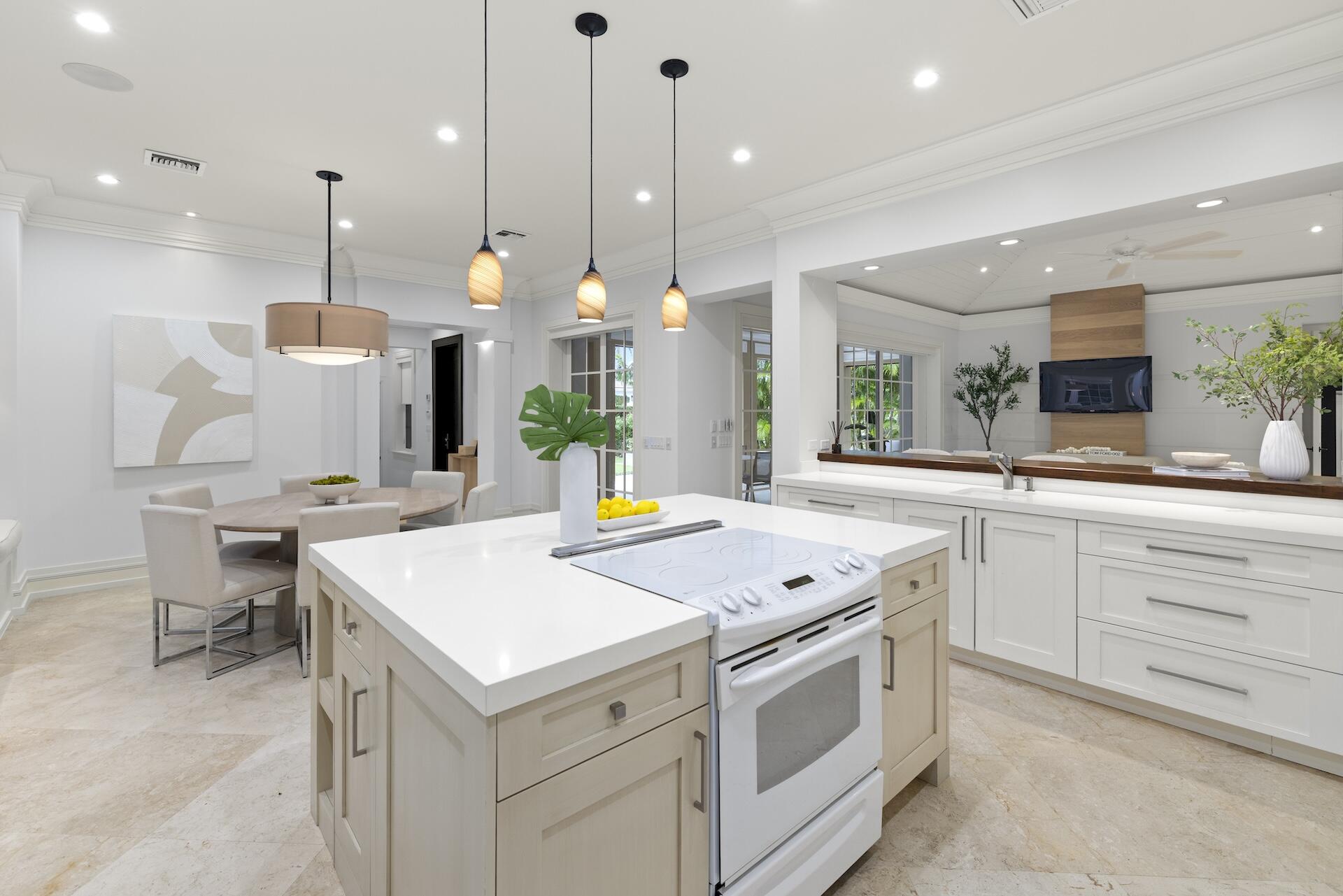 8 Osprey Drive Ocean Ridge, FL 33435 - Photo 11 of 51 a kitchen that has a lot of cabinets in it and appliances