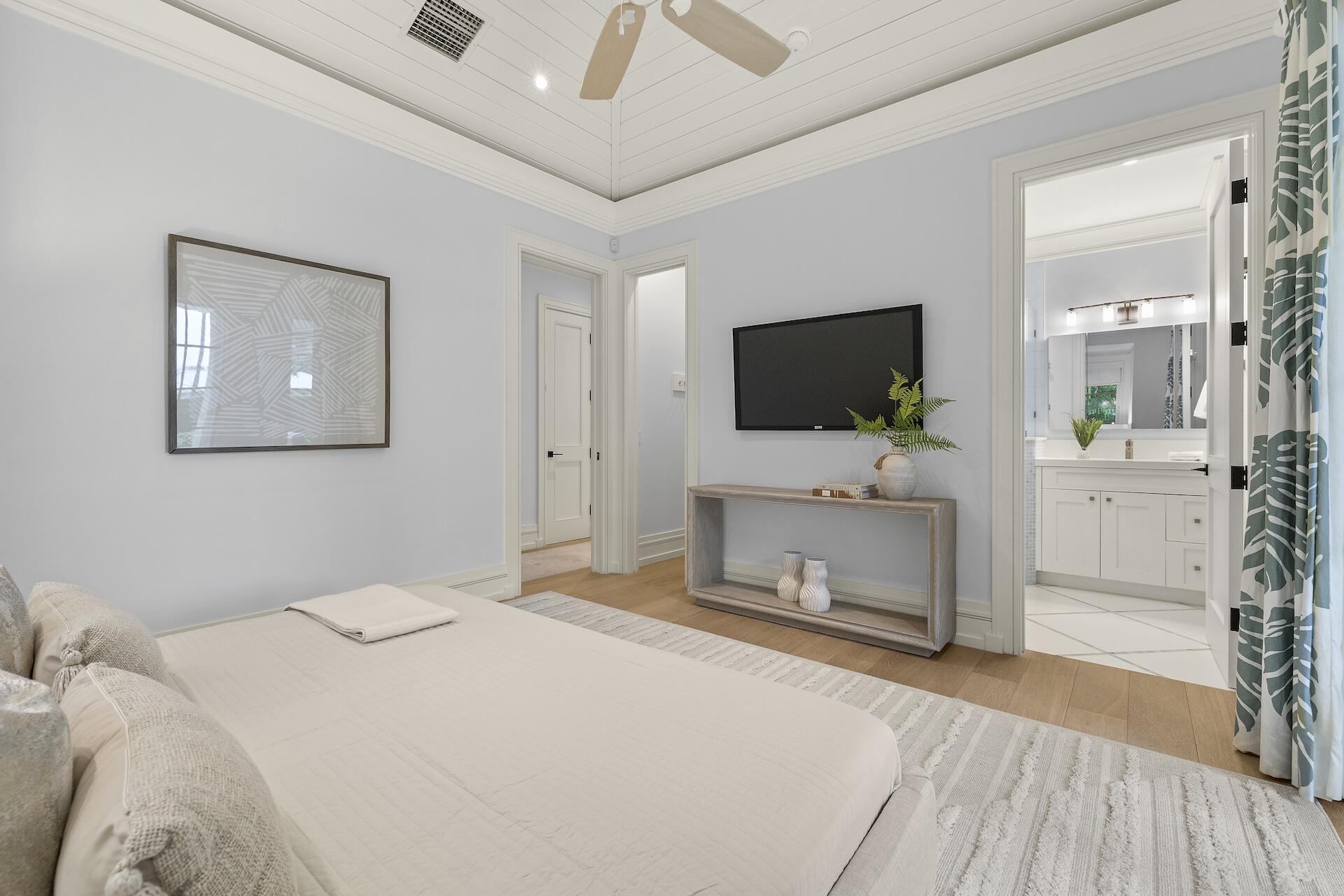 8 Osprey Drive Ocean Ridge, FL 33435 - Photo 16 of 51 a bedroom with a bed and a flat screen tv