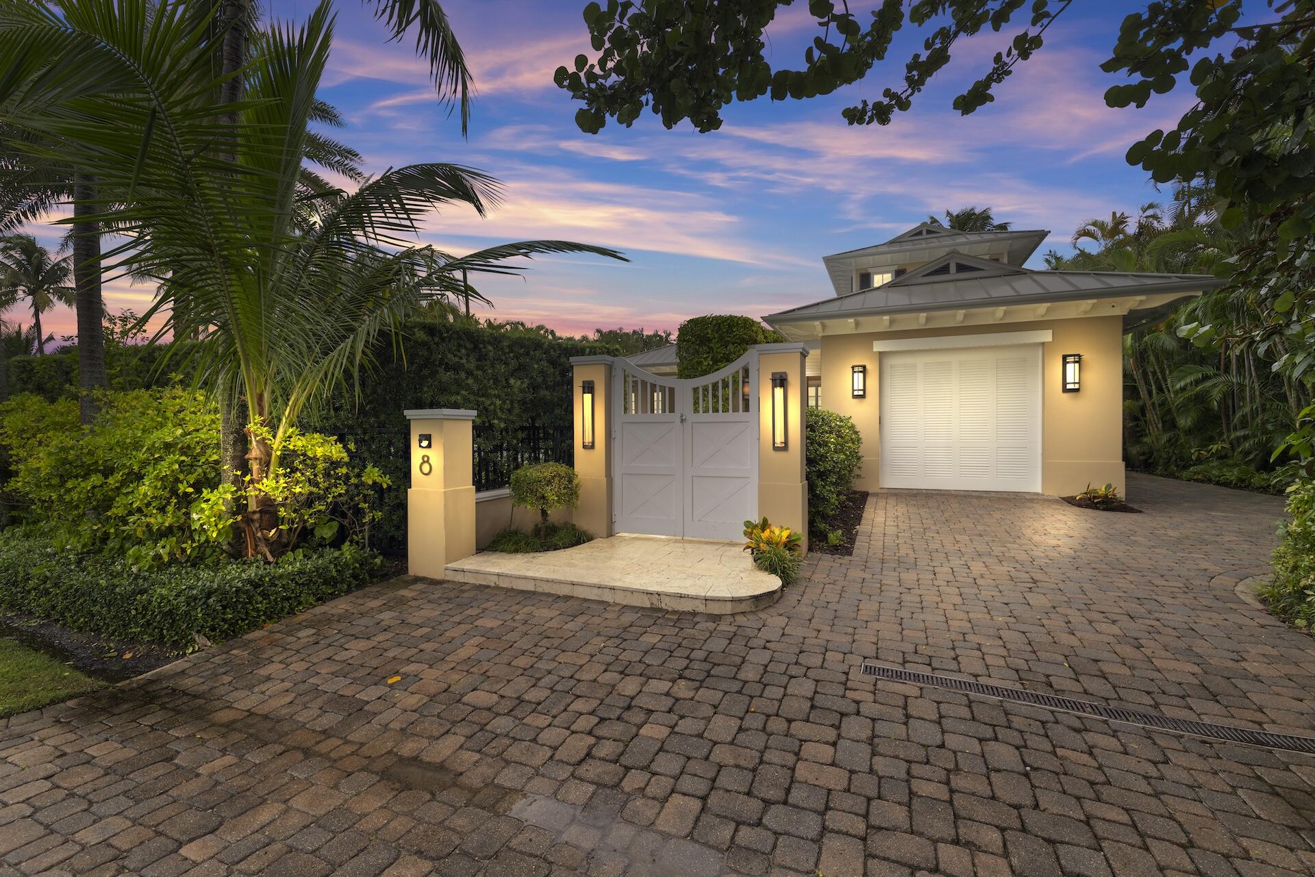 8 Osprey Drive Ocean Ridge, FL 33435 - Photo 2 of 51 a front view of a house with a yard and garage