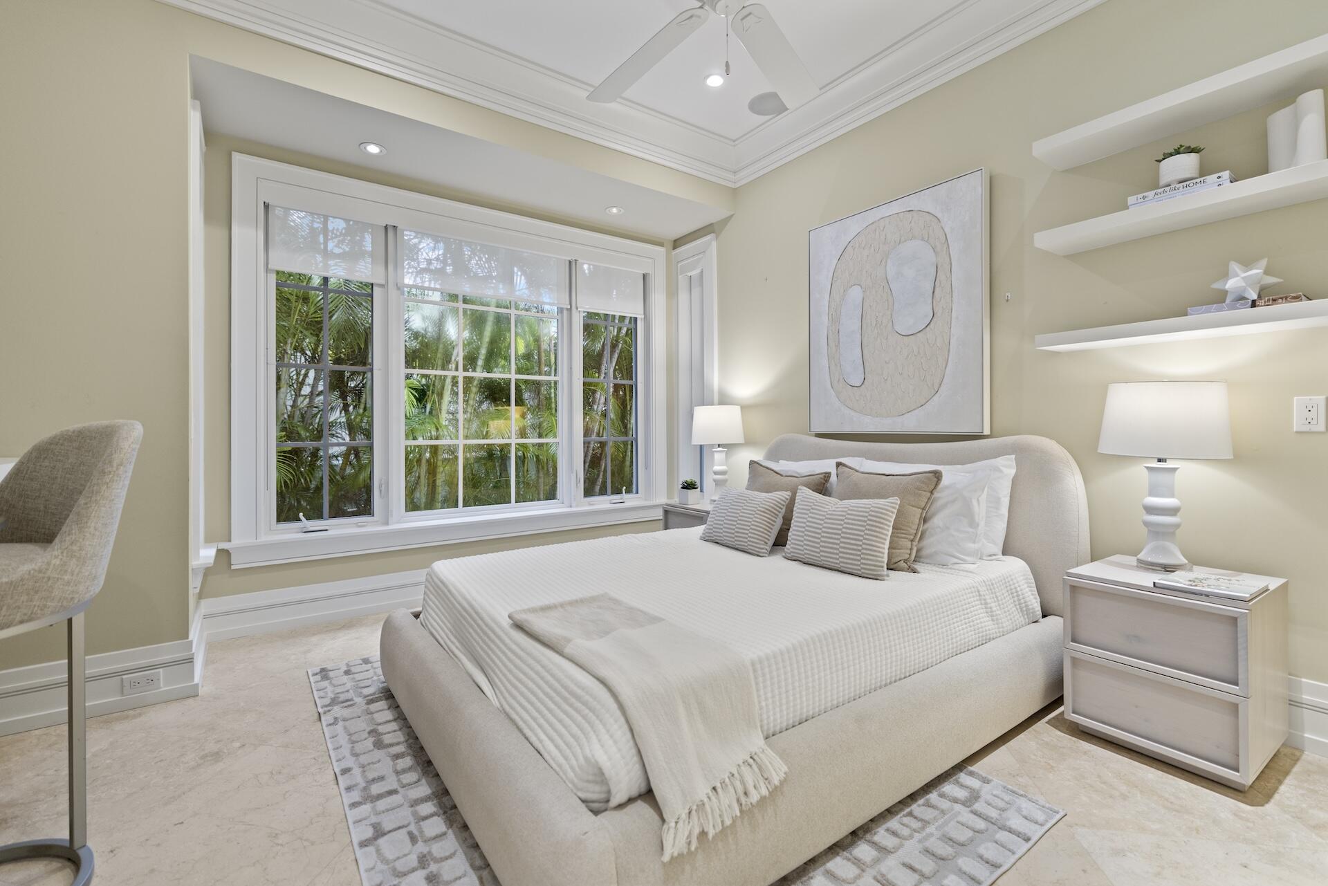 8 Osprey Drive Ocean Ridge, FL 33435 - Photo 24 of 51 a bedroom with bed and a large window